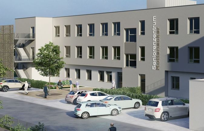 Außenansicht des Seniorenzentrums bei Eröffnung mit Personen und Autos